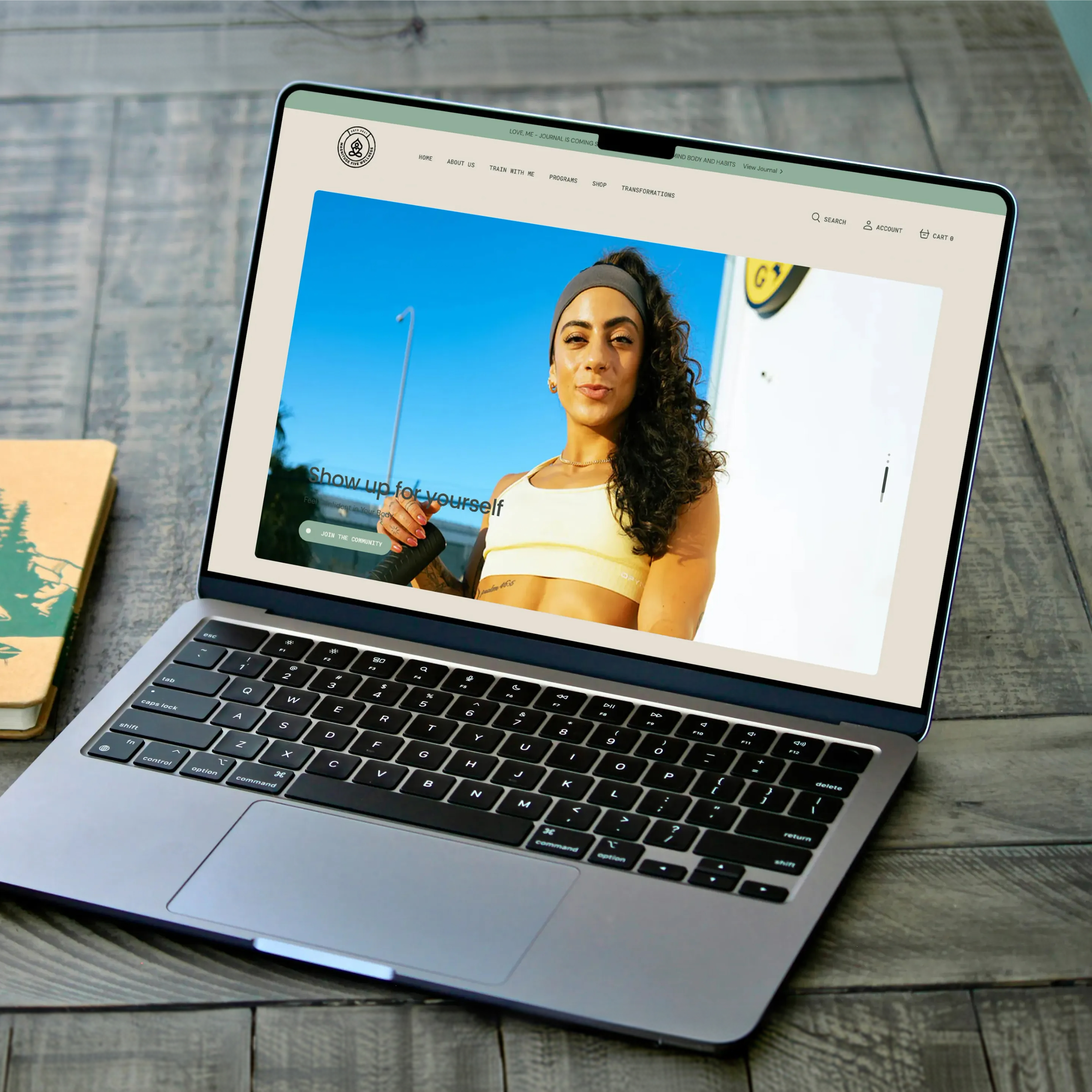 Magnitude5 website homepage shown on a MacBook